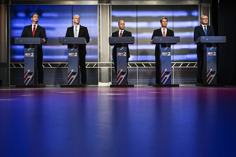 Georgia Republican gubernatorial candidates Michael Williams, standing from left, Clay Tippins, Hunter Hill, Brian Kemp and Casey Cagle wait to start a debate, Sunday, May 20, 2018, in Atlanta. (AP Photo/John Amis)