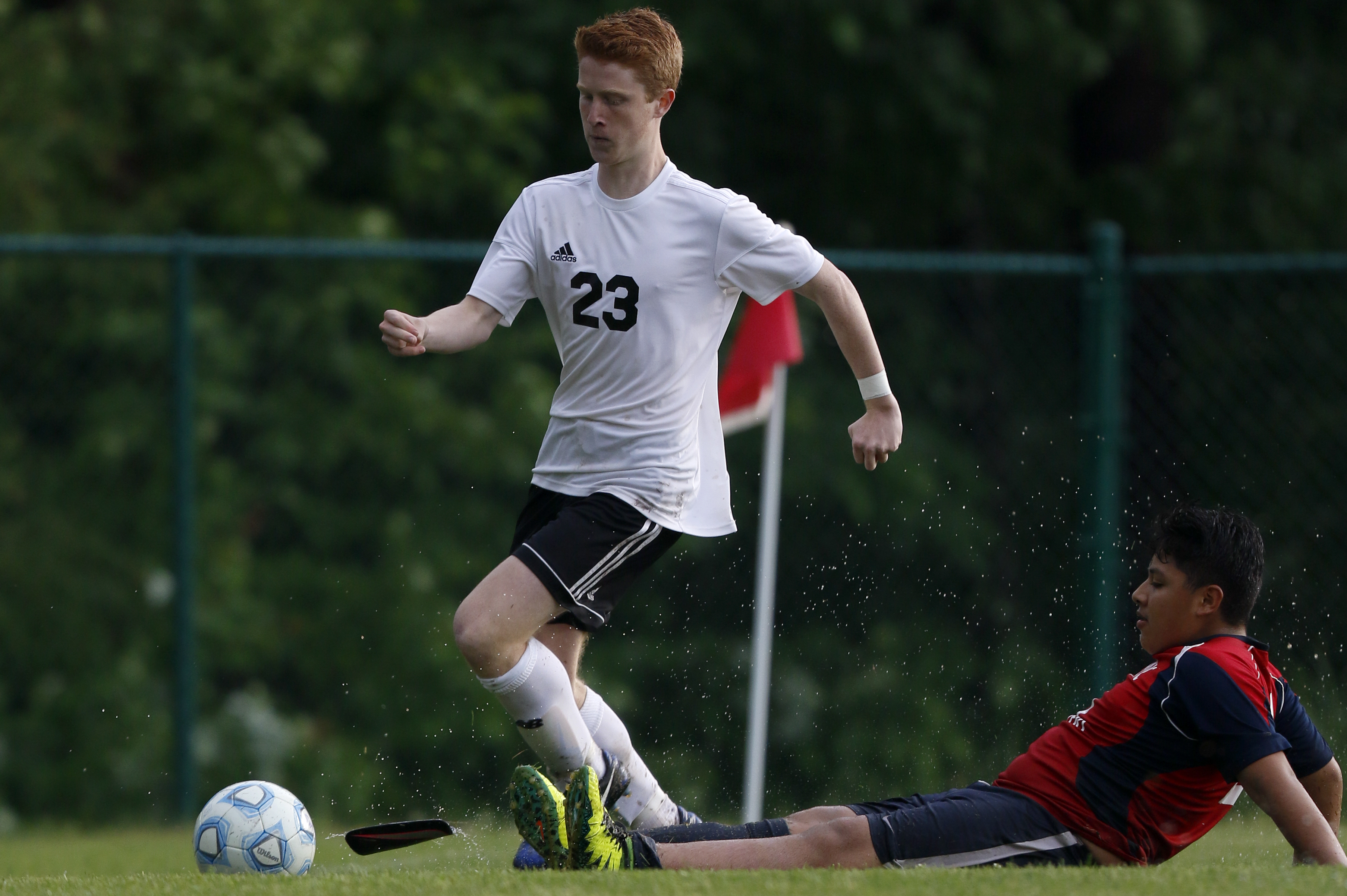 RePublic's Carlos Esquivel (21) loses a shinguard as he challenges Signal Mountain's Remy Newton (23) at Signal Mountain Middle/High School on Sunday, May 20, 2018 in Signal Mountain, Tenn.