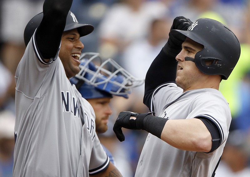 
              New York Yankees' Tyler Austin, right, celebrates with Aaron Hicks after hitting a two-run home run during the fifth inning of a baseball game against the Kansas City Royals, Sunday, May 20, 2018, in Kansas City, Mo. (AP Photo/Charlie Riedel)
            