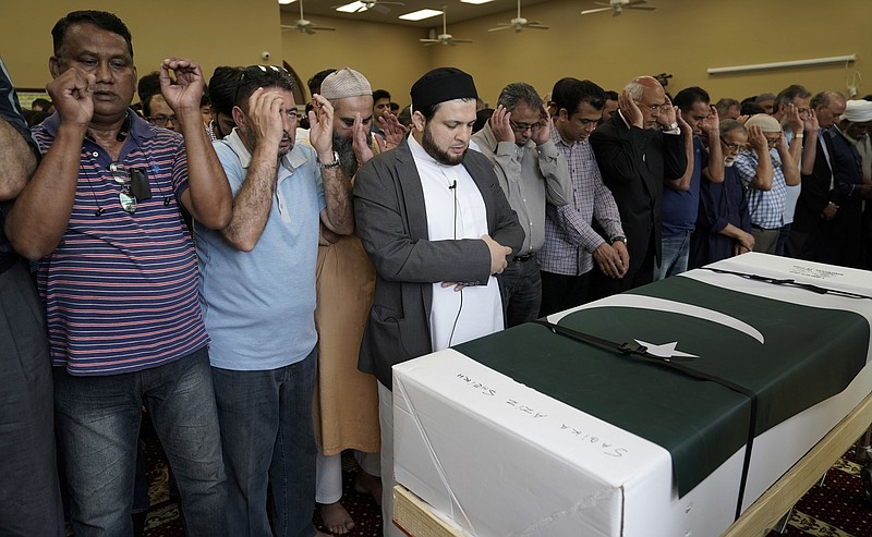 Funeral prayers are offered for Pakistani exchange student Sabika Sheikh, who was killed in the Santa Fe High School shooting, during a service at the Brand Lane Islamic Center Sunday, May 20, 2018, in Stafford, Texas. A gunman opened fire inside Santa Fe High School Friday, May 18, 2018, killing 10 people. (AP Photo/David J. Phillip)
