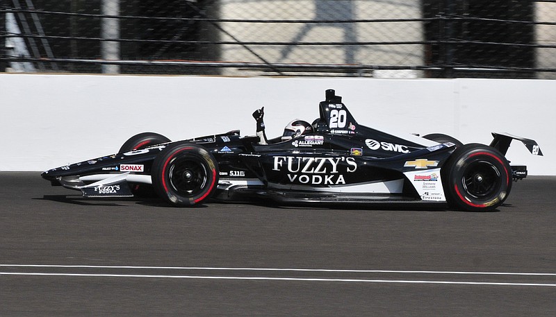 Ed Carpenter pumps his fist after he qualified on the pole for the IndyCar Indianapolis 500 auto race at Indianapolis Motor Speedway in Indianapolis, Sunday, May 20, 2018. (AP Photo/John Maxwell)