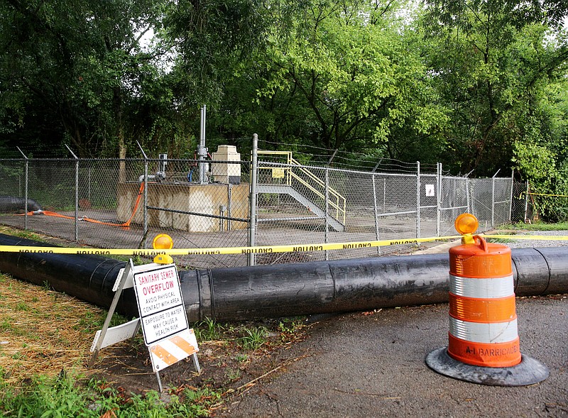 Signs surround the DuPont Pump Station indicating that people should avoid contact with the overflow area Thursday, June 15, 2017, at the corner of Memphis Drive and Elm Street in Chattanooga, Tenn. The key objectives in the DuPont Pump Station overhaul are to prevent stormwater from getting into the sewage network in the first place and increasing the system's capacity.