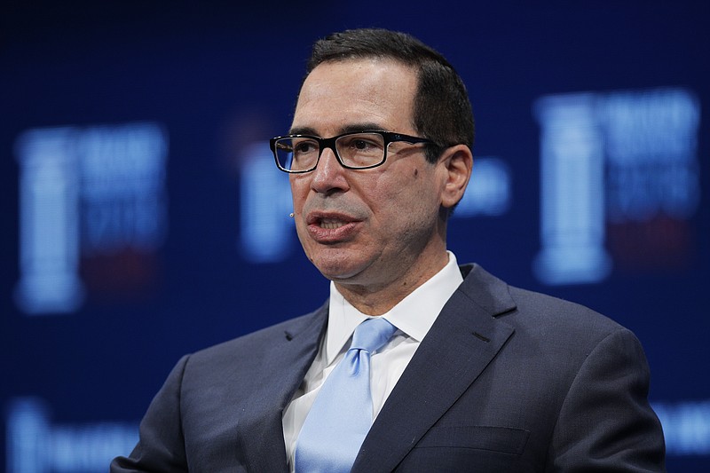 FILE - In this April 30, 2018, file photo, Treasury Secretary Steven Mnuchin speaks during a discussion at the Milken Institute Global Conference, in Beverly Hills, Calif. Mnuchin said Sunday, May 20, that the United States and China are stepping back from a possible trade trade war between the world’s two biggest economies after two days of talks that he said had produced “meaningful progress.” (AP Photo/Jae C. Hong, File)