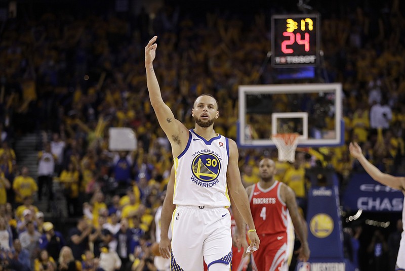 Golden State Warriors guard Stephen Curry (30) gestures against the Houston Rockets during Game 3 of the NBA basketball Western Conference Finals in Oakland, Calif., Sunday, May 20, 2018. (AP Photo/Marcio Jose Sanchez)