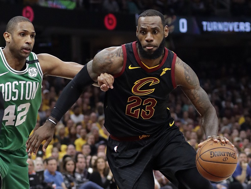 Cleveland Cavaliers' LeBron James (23) drives past Boston Celtics' Al Horford (42), from Dominican Republic, in the first half of Game 4 of the NBA basketball Eastern Conference finals, Monday, May 21, 2018, in Cleveland. (AP Photo/Tony Dejak)