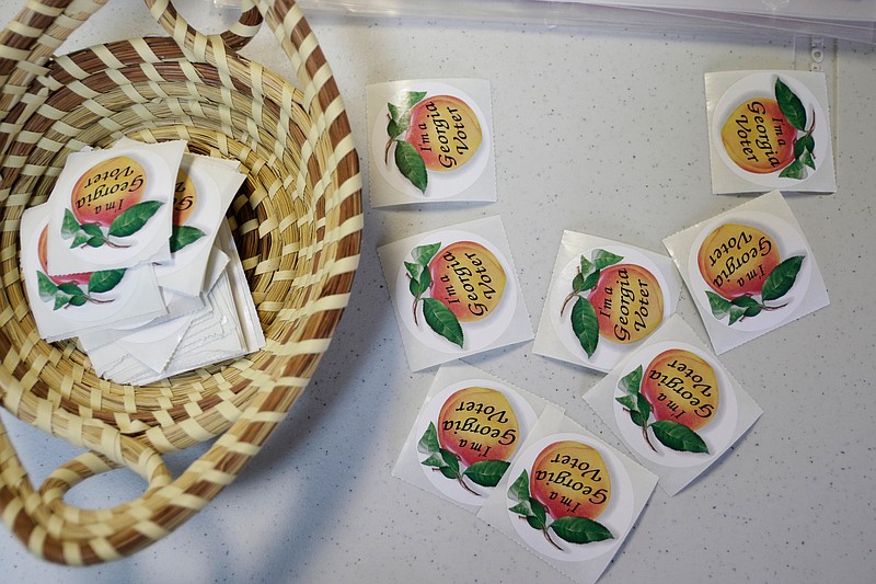 Voting stickers are ready to be taken by voters at the Chickamauga Civic Center on Tuesday, May 22, 2018, in Chickamauga, Ga. Turnout was steady at the polling place for Georgia's Tuesday primary election.