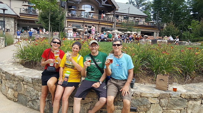 From left, Kris Whorton, Amy Brock-Hon, Kevin Hon and Randy Whorton enjoy beers at Sierra Nevada Brewery along the French Broad River Paddle Trail.