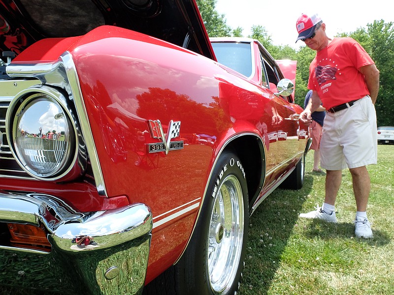 A visitor at a previous Harrison Ruritan Club car show checks out a 1967 Chevelle SS 396. The Ruritan Club's annual fundraiser is Sunday afternoon at the Tennessee Riverpark.