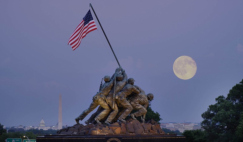 The United States Marine Corps War Memorial in Arlington County, Virginia, was inspired by the 1945 photograph of six Marines raising the U.S. flag on Mount Suribachi during the Battle of Iwo Jima in World War II.