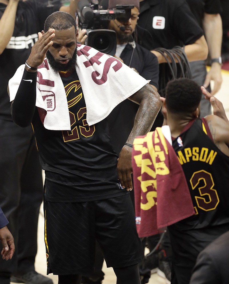 
              Cleveland Cavaliers' LeBron James (23) celebrates with Tristan Thompson after a 111-102 victory over the Boston Celtics in Game 4 of the NBA basketball Eastern Conference finals, Monday, May 21, 2018, in Cleveland. (AP Photo/Tony Dejak)
            