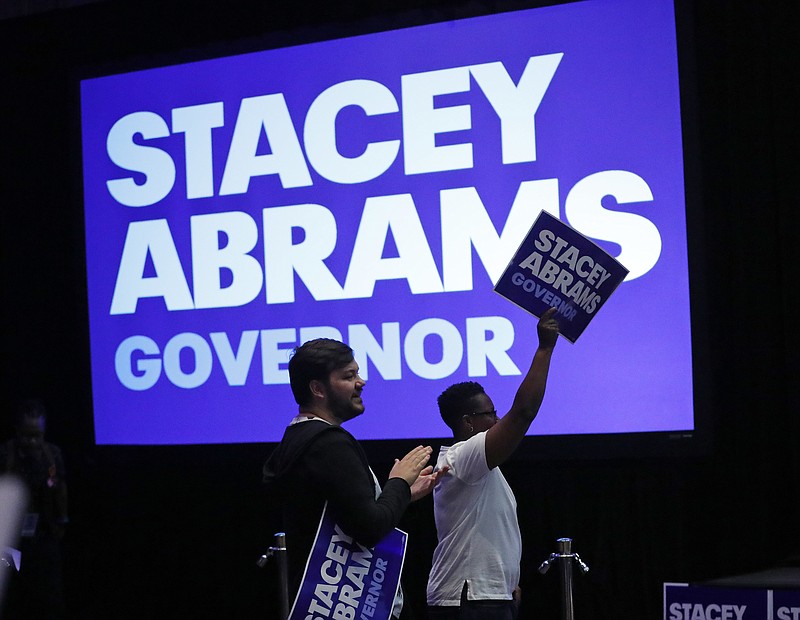 Supporters react during an election-night watch party for Georgia Democratic gubernatorial candidate Stacey Abrams, Tuesday, May 22, 2018, in Atlanta. (AP Photo/John Bazemore)