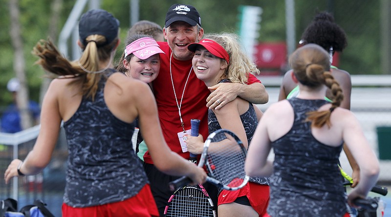 Assistant coach Gordon Williams, center, and No. 2 doubles partners Grace Williams, center left, and Sarah Kate Bailey, center right, look on as teammates Mary Elizabeth Wakim, left, and Callie Mastin run to join them in celebration after clinching the Division I Small Class state championship against L&N STEM Acadmey during Spring Fling XXV at Adams Tennis Complex on Wednesday, May 23, 2018 in Murfreesboro, Tenn.