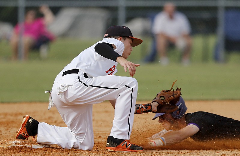 South Pittsburg's Will Olinger (1) gets the tag on Trinity Christian's Lane Lamberth (6) to pick him off trying to steal second base during Spring Fling XXV at Middle Tennis Christian School's Joe Baron Field on Tuesday, May 22, 2018 in Murfreesboro, Tenn.