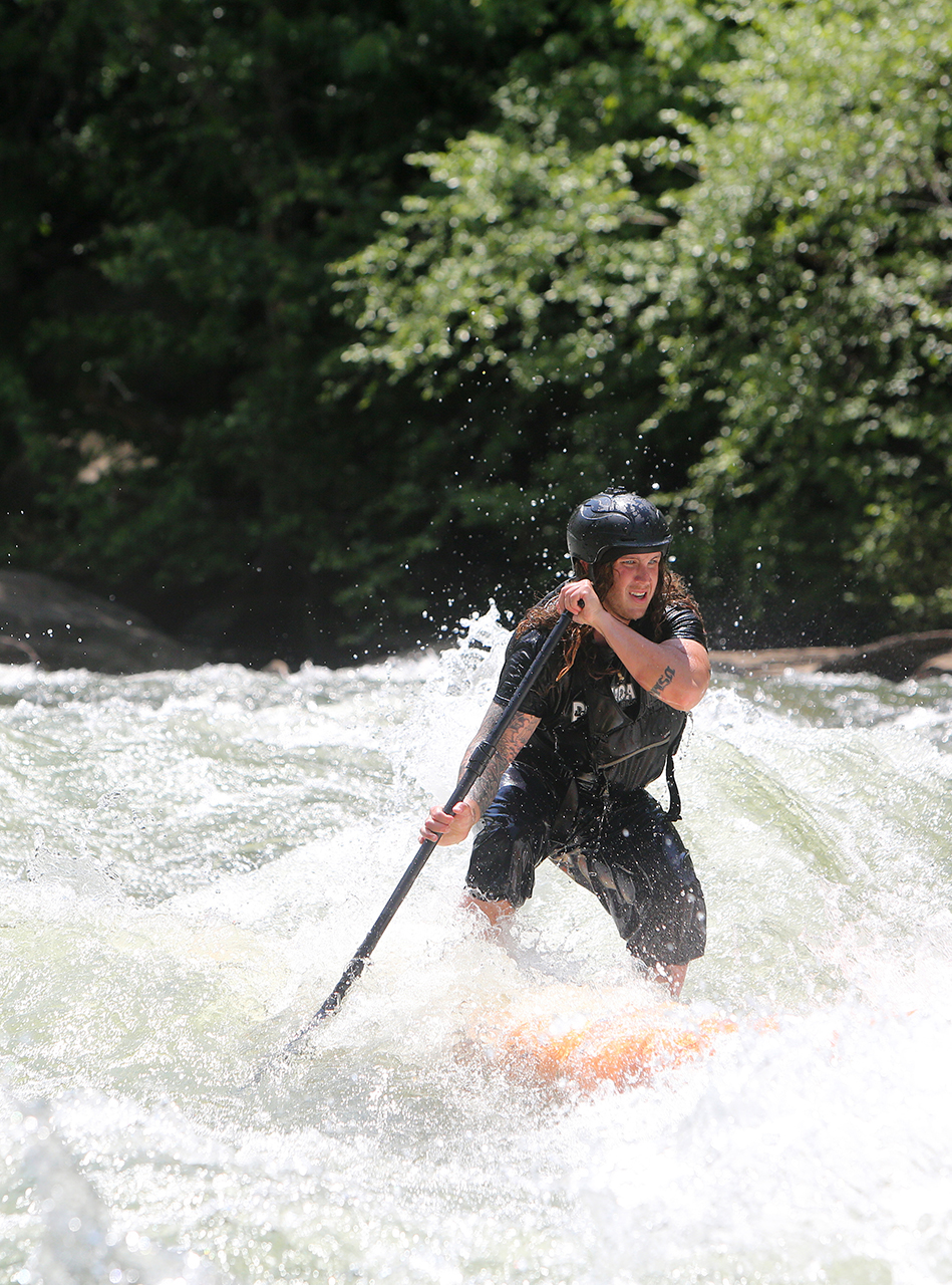 Alex Storgion, 26, makes his way through rapids on his standup paddle board on the Ocoee River in Benton, Tenn., Monday, May 14, 2018.