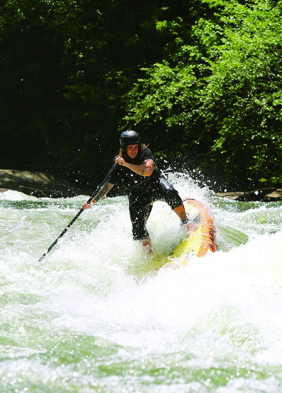 Alex Storgion, 26, makes his way through rapids on his standup paddle board on the Ocoee River in Benton, Tenn., Monday, May 14, 2018.