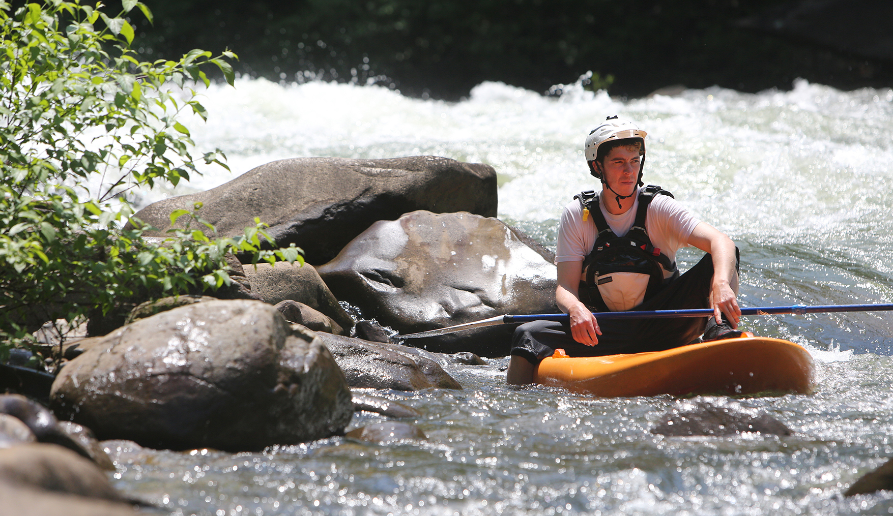 Chris Storgion, 24, sits on his standup paddle board waiting for his brother to come around the bend on the Ocoee River in Benton, Tenn., Monday, May 14, 2018.