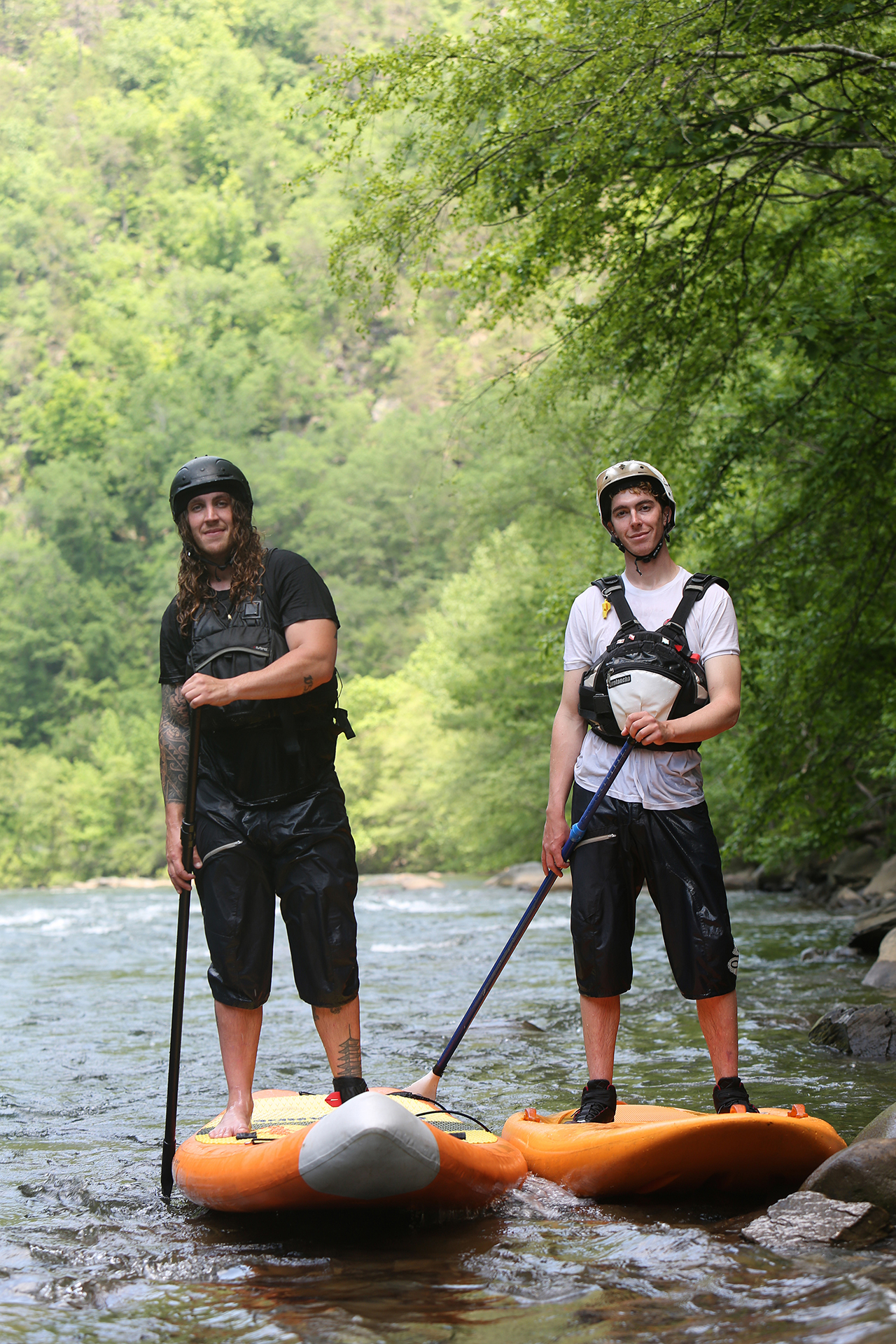 Alex Storgion, 26, and Chris Storgion, 24, pose for a photo with their paddle boards on the Ocoee River in Benton, Tenn., Monday, May 14, 2018.