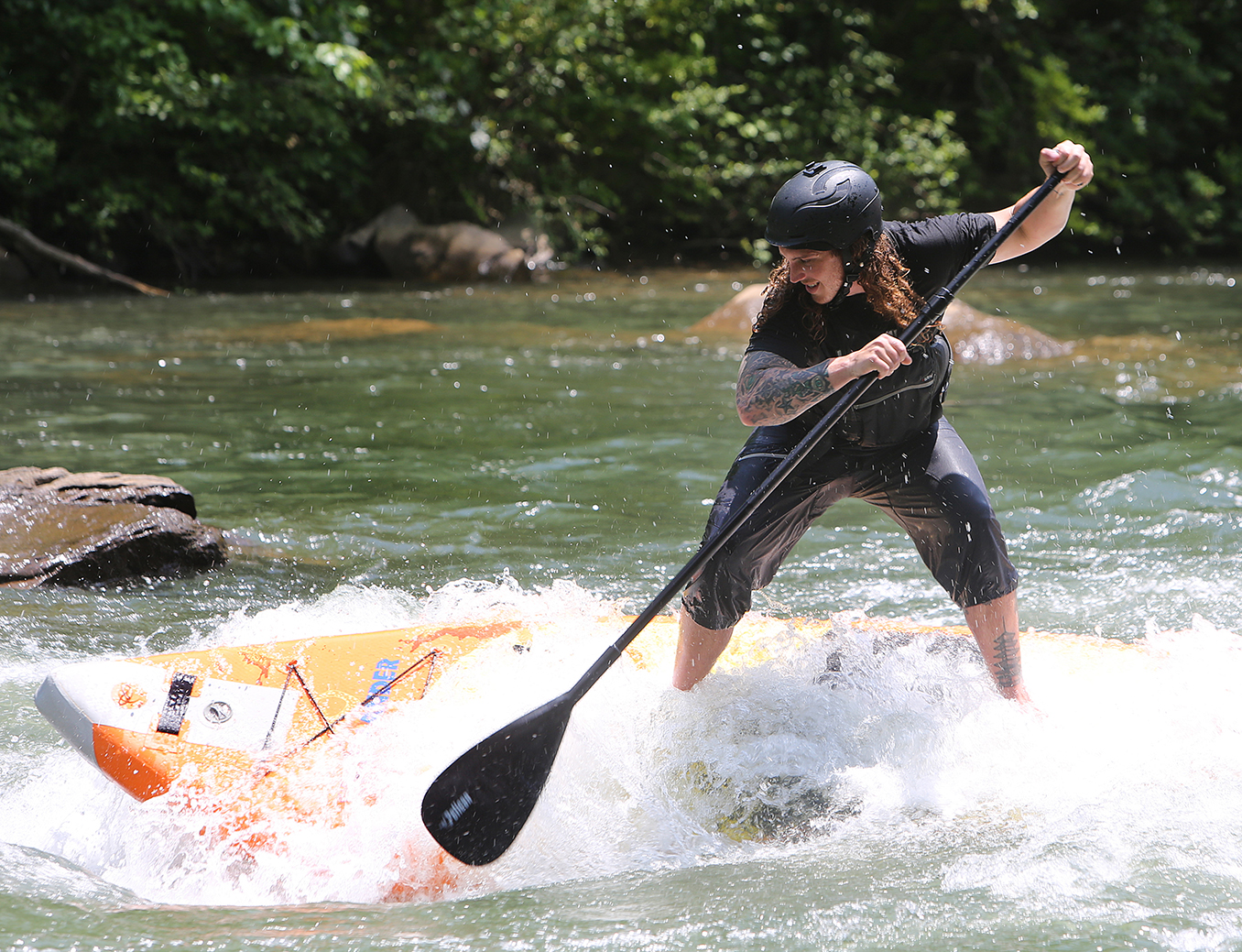 Alex Storgion, 26, makes his way through rapids on his standup paddle board on the Ocoee River in Benton, Tenn., Monday, May 14, 2018.