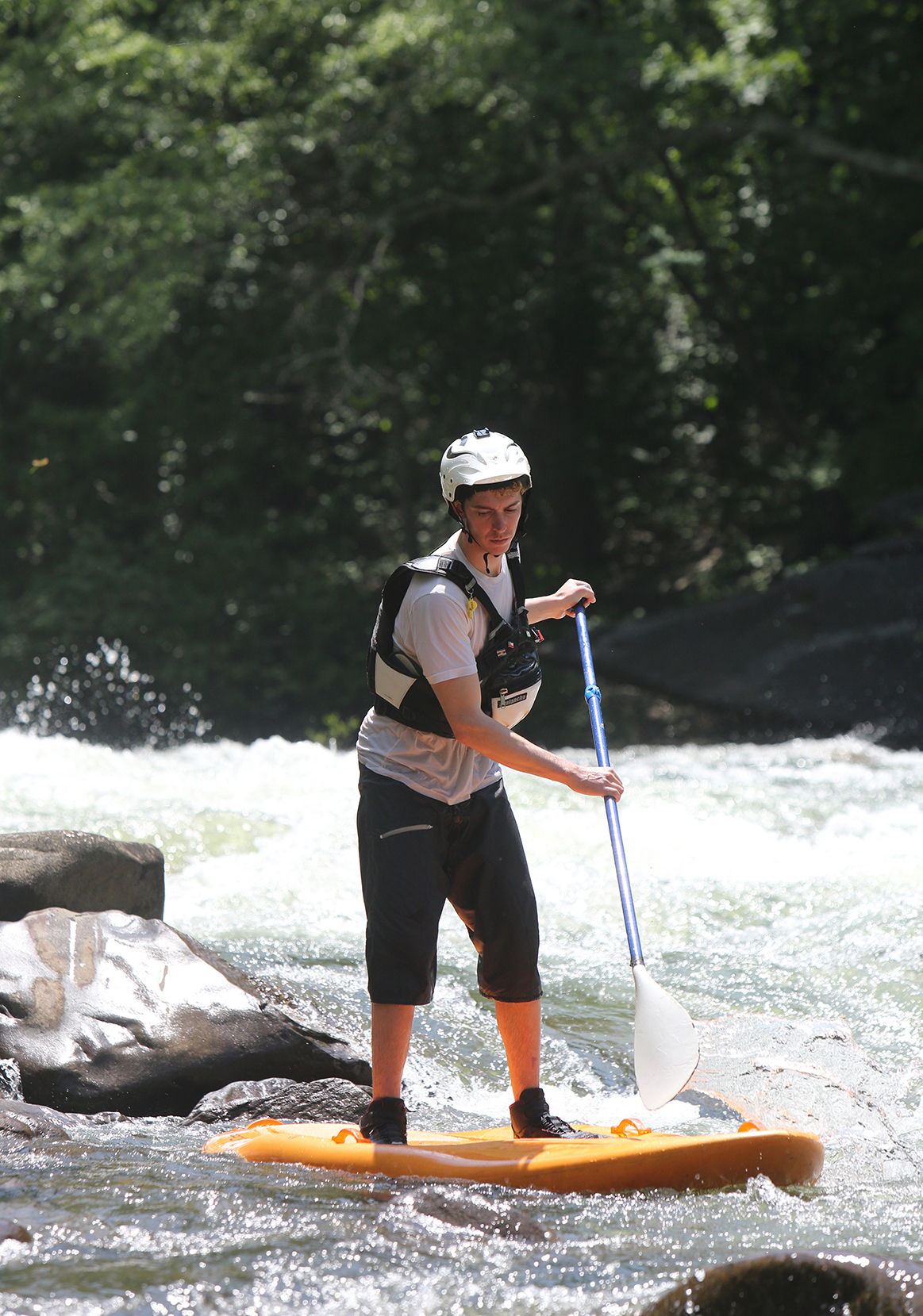 Chris Storgion, 24, balances on his standup paddle board on the Ocoee River in Benton, Tenn., Monday, May 14, 2018.