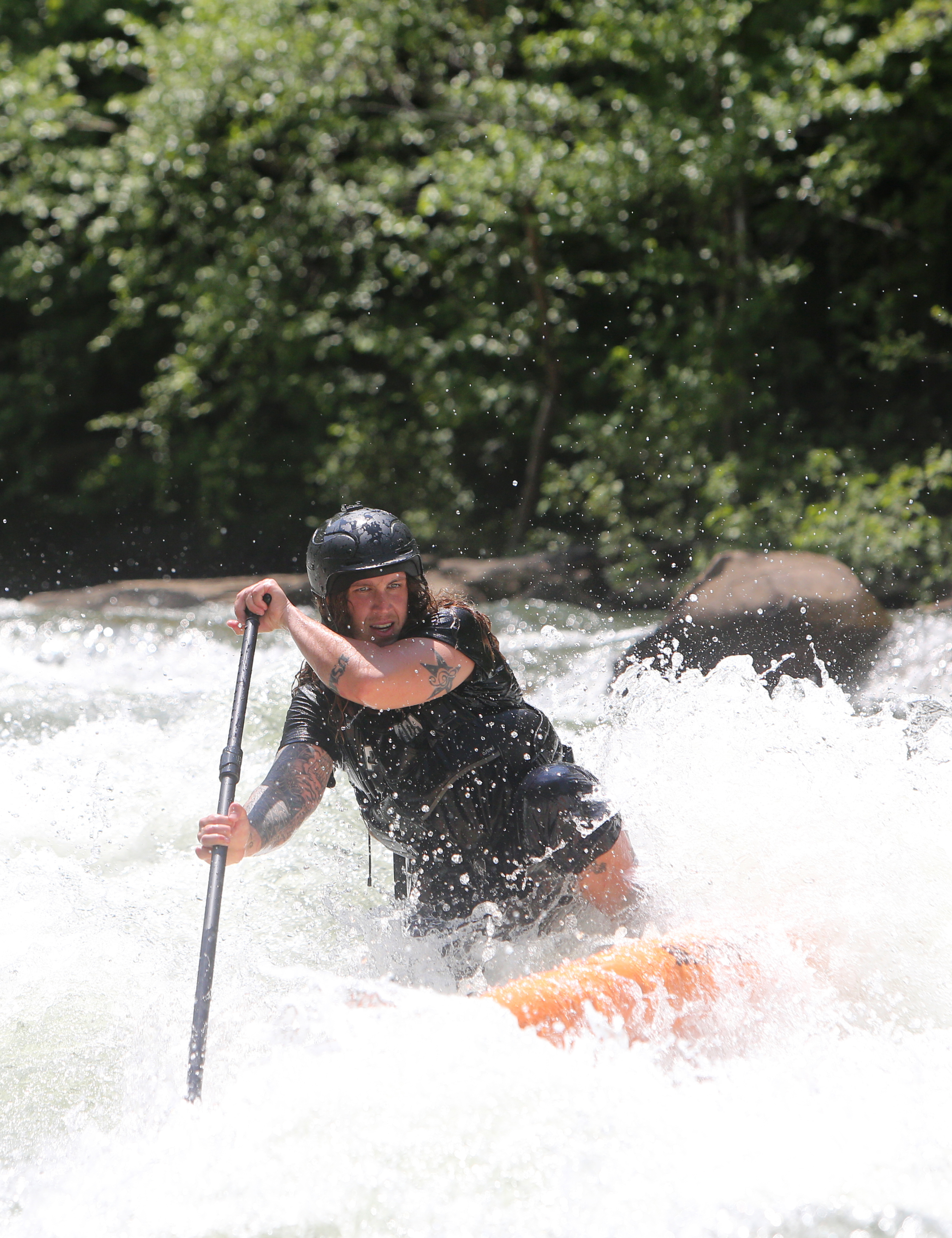 Alex Storgion, 26, makes his way through rapids on his standup paddle board on the Ocoee River in Benton, Tenn., Monday, May 14, 2018.
