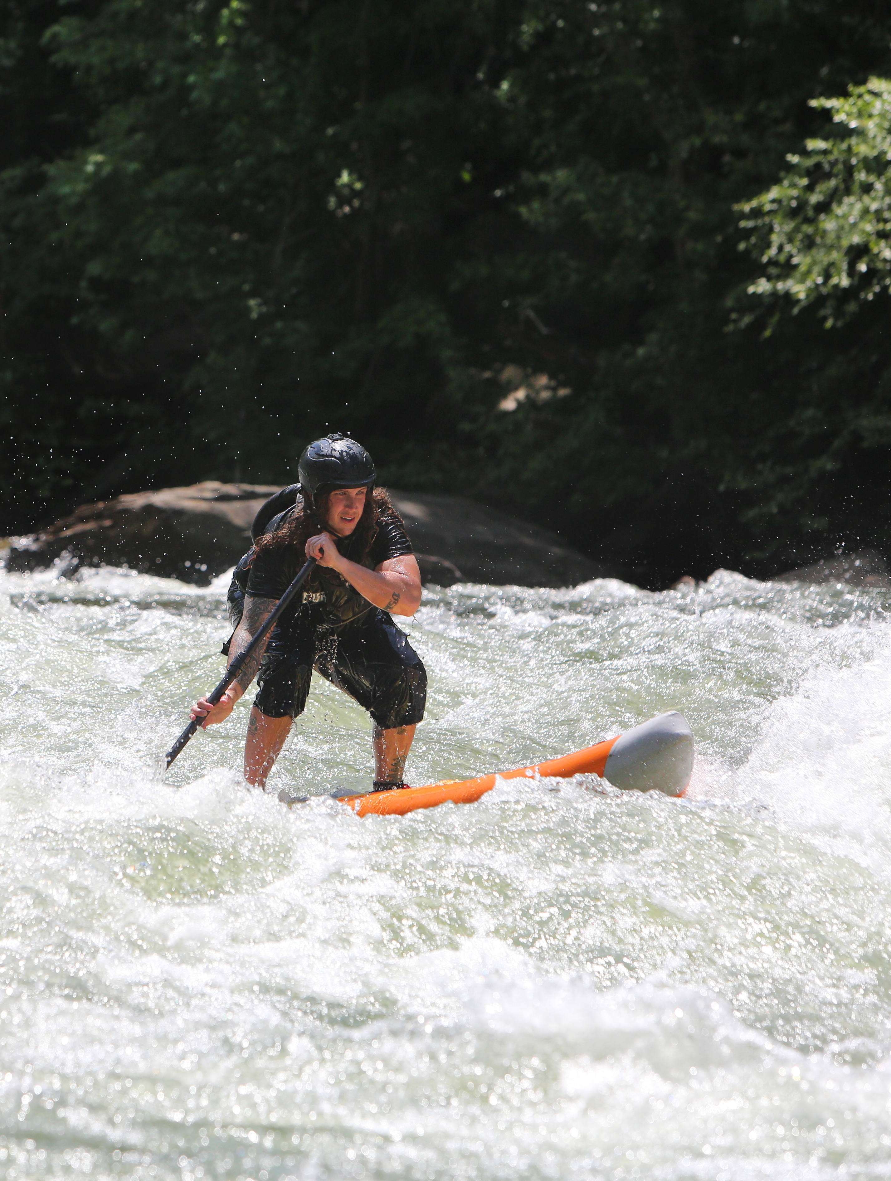 Alex Storgion, 26, makes his way through rapids on his standup paddle board on the Ocoee River in Benton, Tenn., Monday, May 14, 2018.