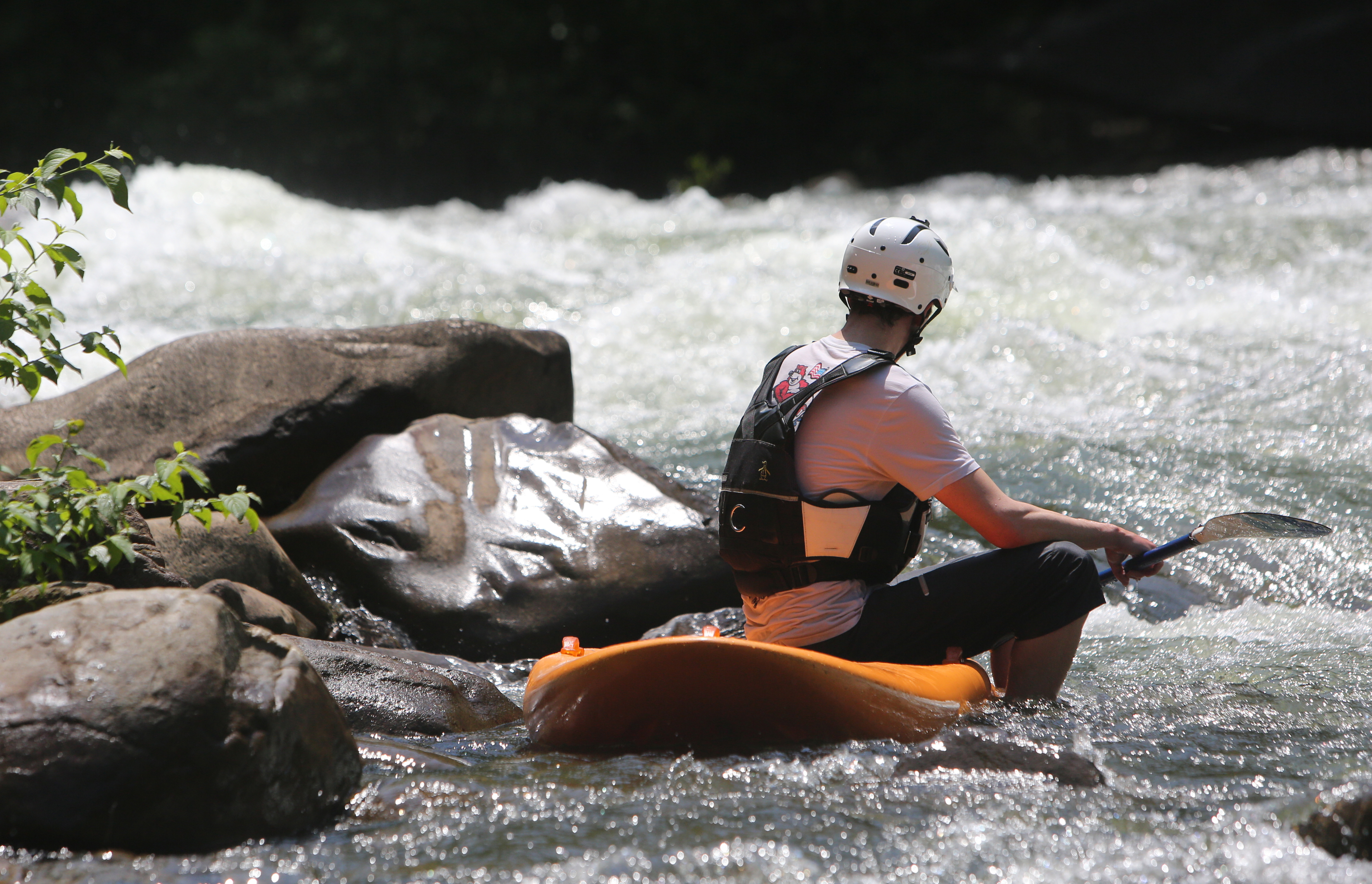 Chris Storgion, 24, sits on his standup paddle board waiting for his brother to come around the bend on the Ocoee River in Benton, Tenn., Monday, May 14, 2018.