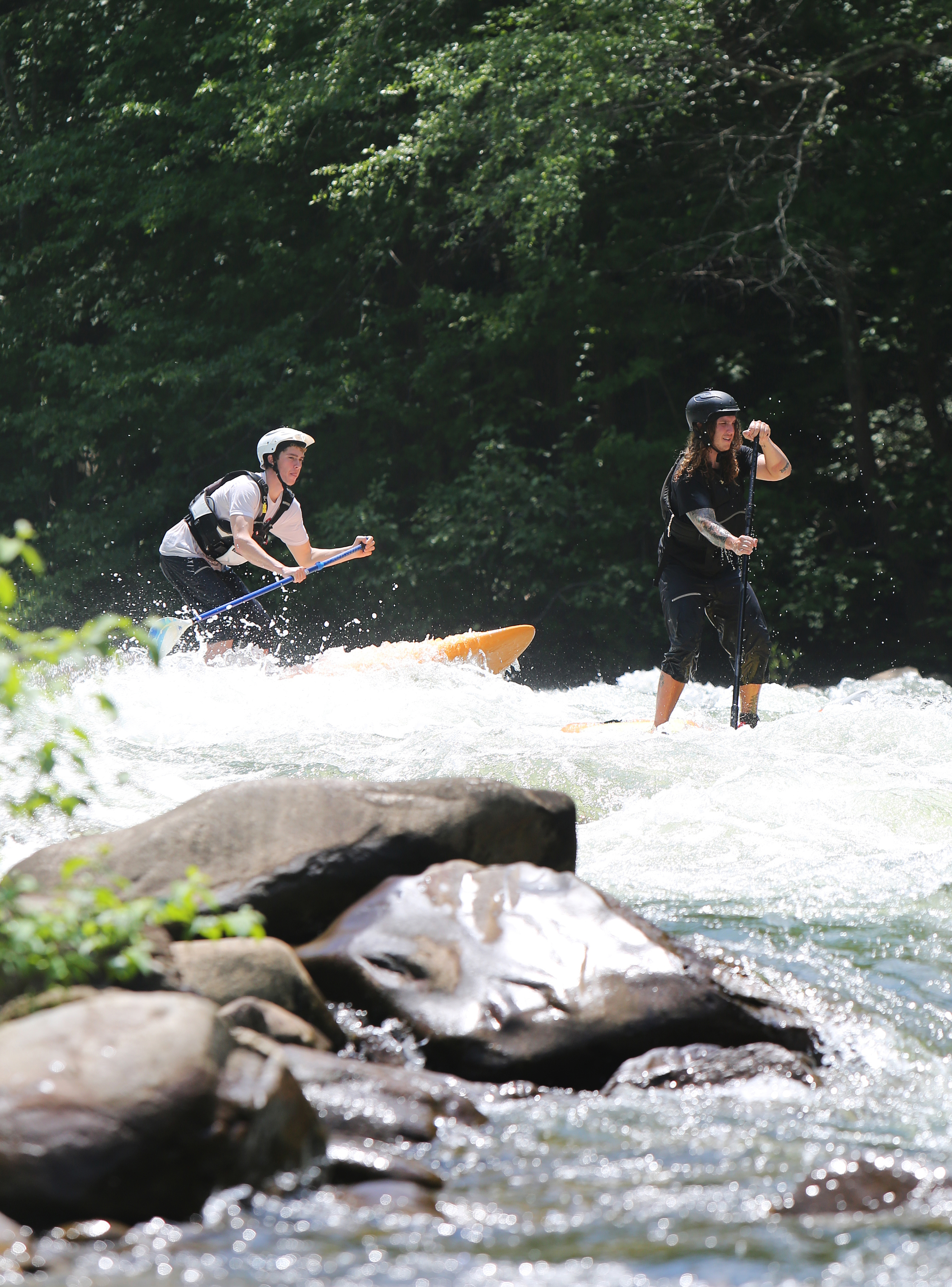 Chris Storgion, 24, and Alex Storgion, 26, make their way through rapids on the Ocoee River in Benton, Tenn., Monday, May 14, 2018.