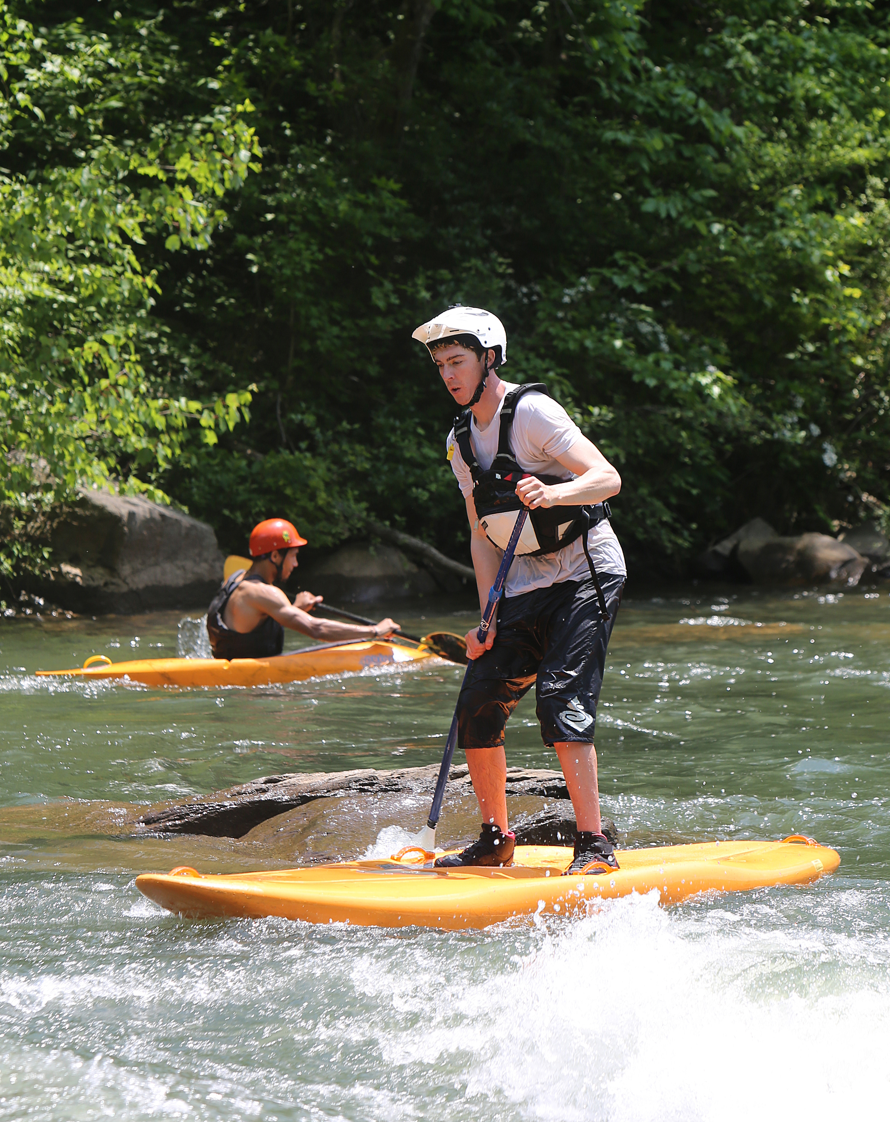 Chris Storgion, 24, makes his way through rapids on his standup paddle board on the Ocoee River in Benton, Tenn., Monday, May 14, 2018.