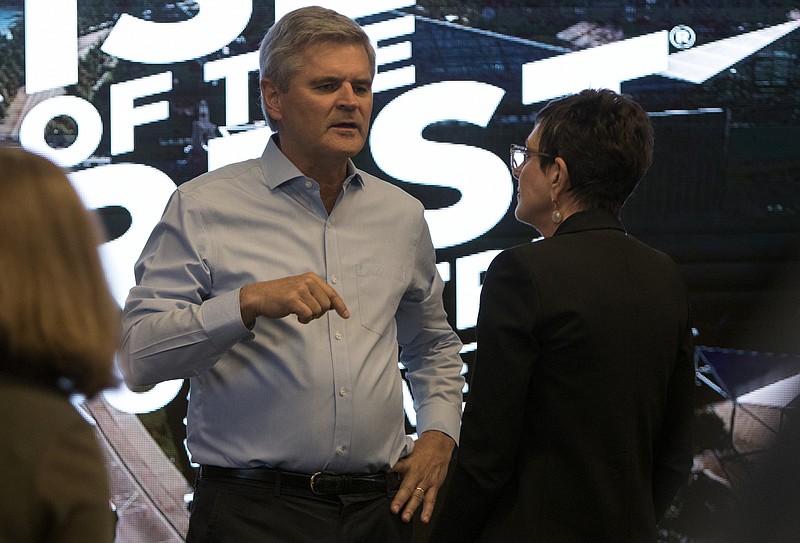 AOL founder Steve Case, left, speaks with Kim White, president of River City Company, at the Songbirds Guitar Museum during the Rise of the Rest seed fund tour's stop in Chattanooga, Tenn. on Thursday, May 10, 2018.
