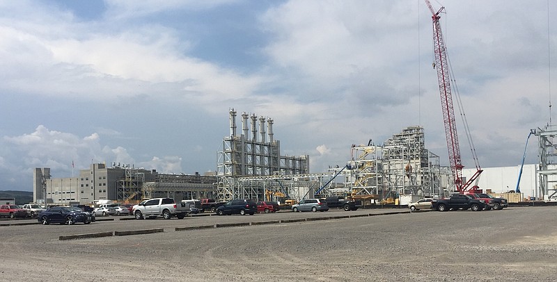 Construction crews work on the $150 million expansion of the $2.5 billion Wacker Chemical plant in Charleston, Tenn., where an explosion last September forced the company to idle production for nearly eight months.