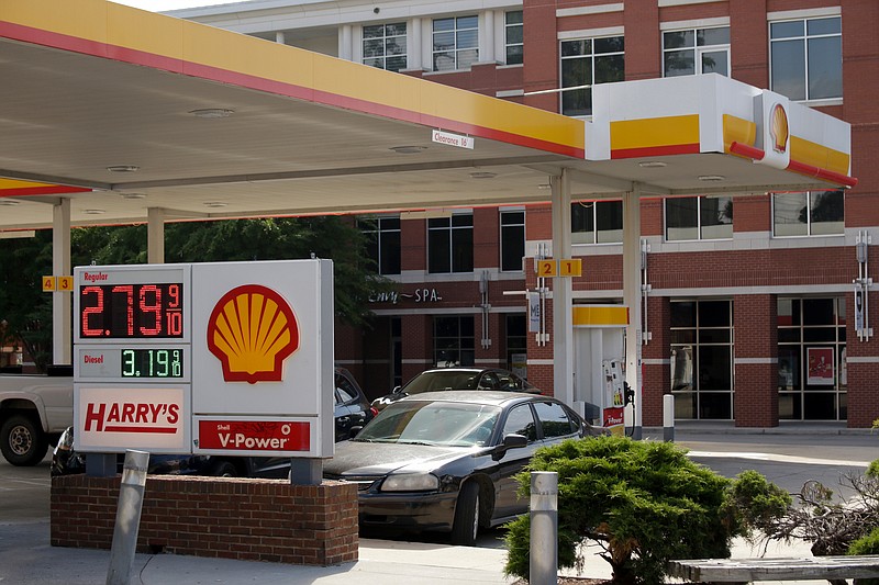A sign reads $2.79/gallon for regular unleaded gasoline at the Harry's convenience store and Shell gas station on Frazier Avenue on Wednesday, May 23, 2018, in Chattanooga, Tenn. Higher gas prices are expected during the weekend's Memorial Day travel.