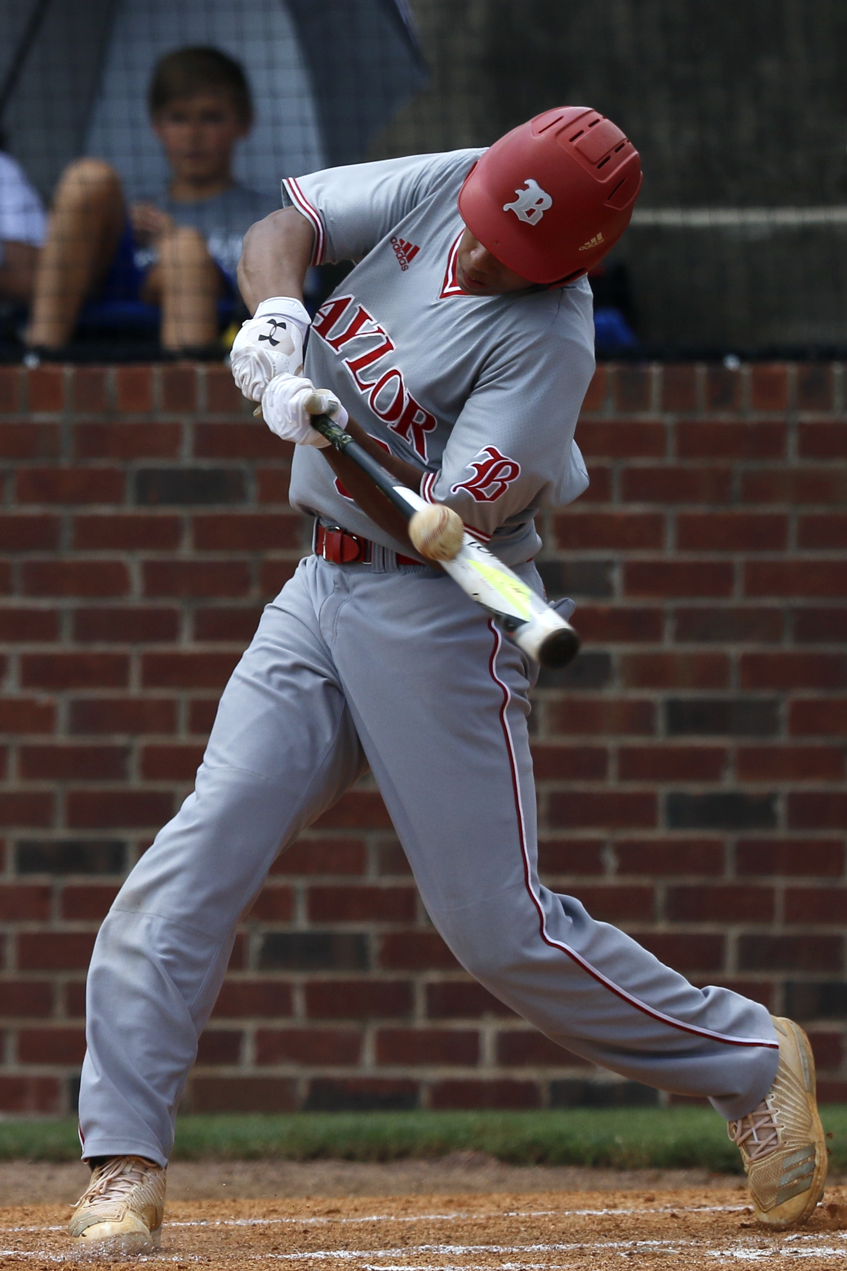 Baylor's Daniel Corona connects for an RBI single against McCallie on Wednesday in Lebanon, Tennessee. Baylor won 11-7 to advance to today's title round of the TSSAA Division II-AA baseball state tournament.