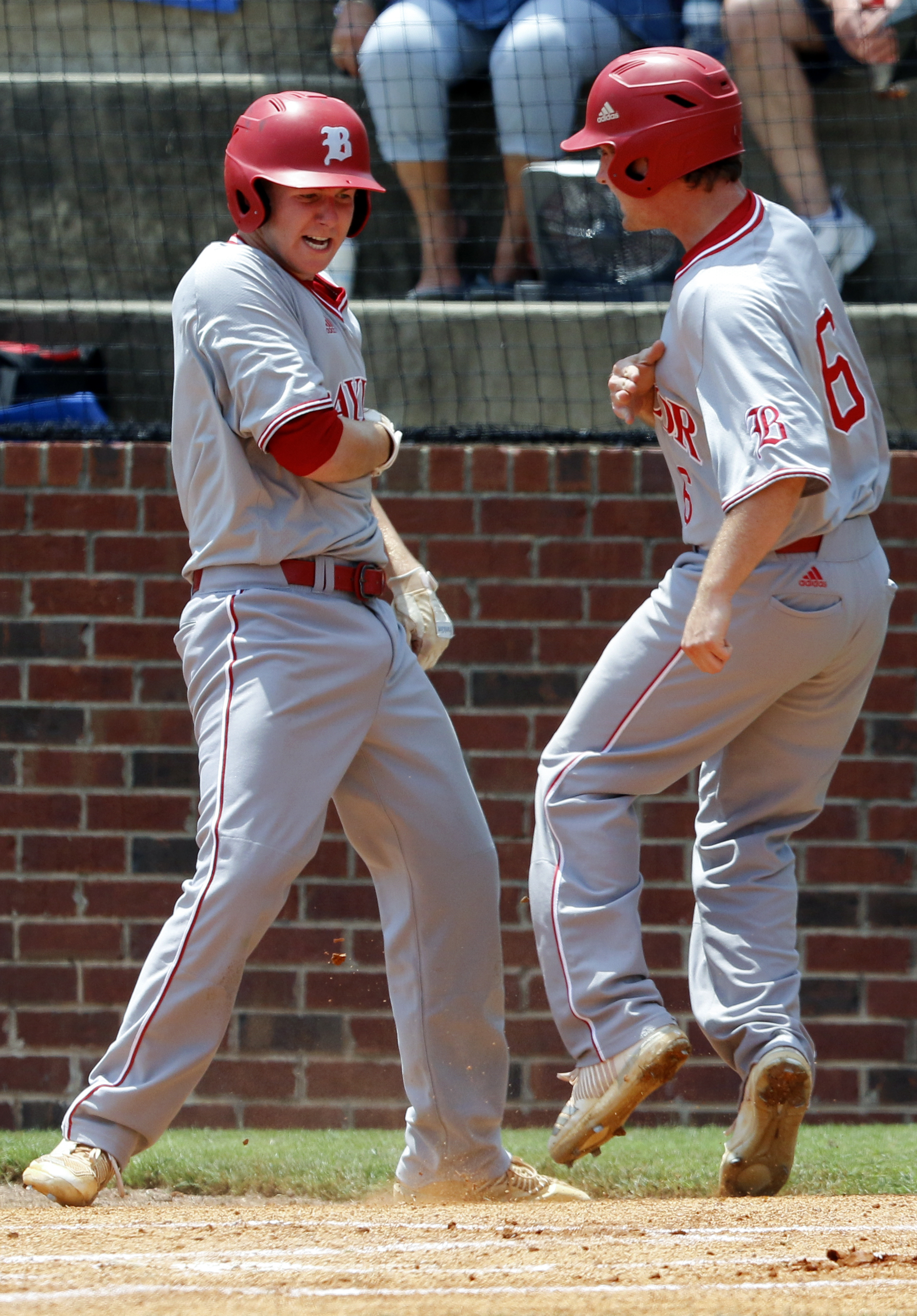 Baylor's Teddy Lepcio, left, and Stanley King celebrate after scoring during the Division II Class AA winner's bracket final against McCallie at Wilson Central High School during Spring Fling XXV on Wednesday, May 23, 2018 in Lebanon, Tenn.