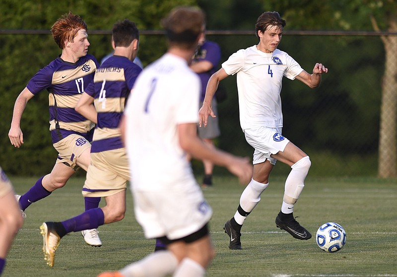 McCallie's Benjamin Brock (4) breaks away toward the Christian Brothers's goal.  The McCallie School soccer team played Christian Brothers in the TSSAA Division II Class AA soccer tournament on May 23, 2018.