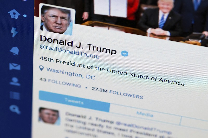 FILE - This April 3, 2017, file photo shows U.S. President Donald Trump's Twitter feed on a computer screen in Washington. 