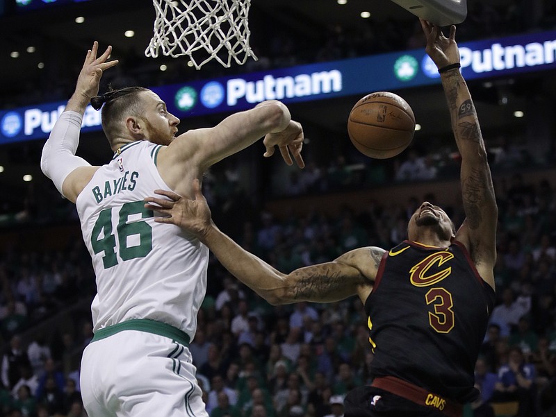 Boston Celtics center Aron Baynes (46) blocks a shot by Cleveland Cavaliers guard George Hill (3) during the first quarter of Game 5 of the NBA basketball Eastern Conference finals Wednesday, May 23, 2018, in Boston. (AP Photo/Charles Krupa)