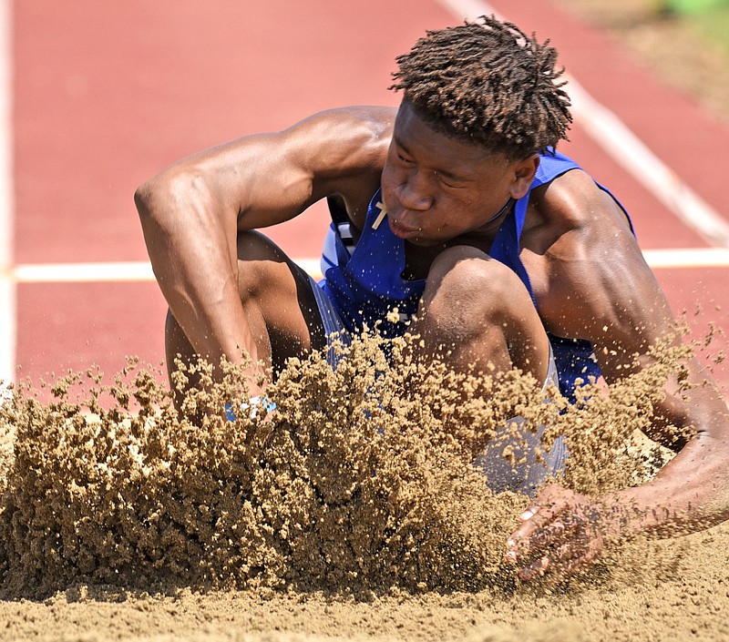 Staff Photo by Robin Rudd
Cleveland's David Dorsey lands in the pit as he competes in the long jump at MTSU in TSSAA Spring Fling action in Murfreesboro, Tenn. on May 24, 2018.
