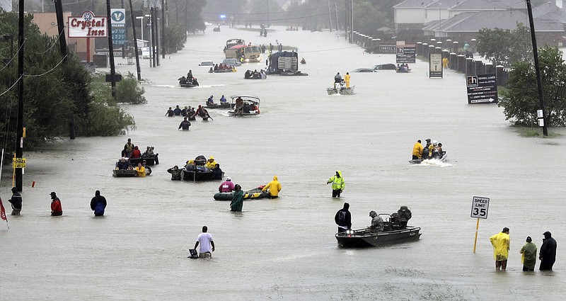 
              FILE - In this Aug. 28, 2017, file photo rescue boats float on a flooded street as people are evacuated from rising floodwaters brought on by Tropical Storm Harvey. U.S. government forecasters are expecting an active Atlantic hurricane season. The National Oceanic and Atmospheric Administration forecast released Thursday, May 24, 2018, calls for about 10 to 16 named storms, with about five to nine hurricanes. (AP Photo/David J. Phillip, File)
            