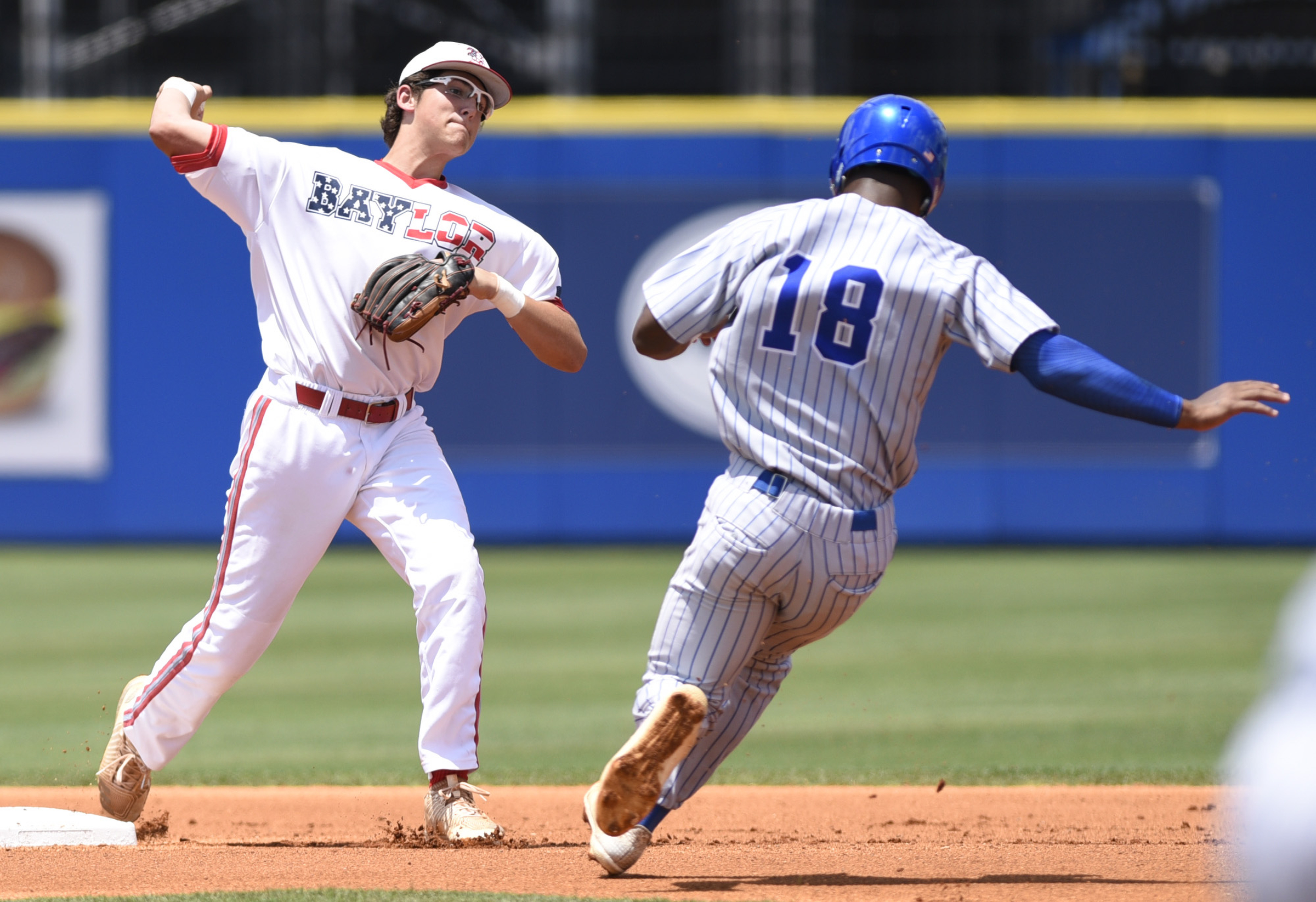 Baylor second baseman Cooper Kinney (8) turns a the front end of a double play as he forces MUS's Maurice Hampton (18) during the Division II-AA baseball championship against Memphis University School in TSSAA Spring Fling action in Murfreesboro, Tenn. on May 24, 2018.