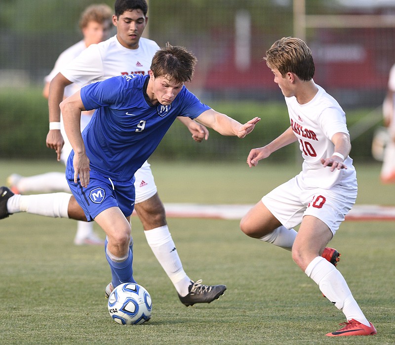 McCallie's Thomas Priest (9) tries to control the ball as Baylor's Eemeli Makela (10) moves in the state championship game in TSSAA Spring Fling action in Murfreesboro, Tenn. on May 24, 2018.