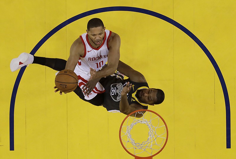 Houston Rockets guard Eric Gordon (10) shoots against Golden State Warriors forward Kevin Durant (35) during the second half of Game 4 of the NBA basketball Western Conference Finals in Oakland, Calif., Tuesday, May 22, 2018. (AP Photo/Marcio Jose Sanchez)