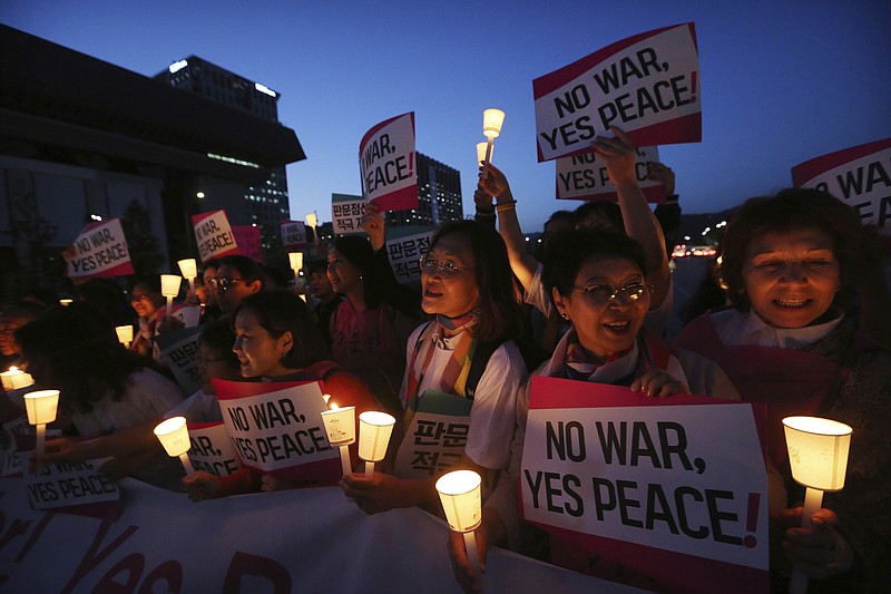 Women protesters stage a rally for peace on the Korea peninsular near U.S. Embassy in Seoul, Wednesday, May 23, 2018. U.S. President Donald Trump labored with South Korea's Moon Jae-in Tuesday to keep the highly anticipated U.S. summit with North Korea on track after Trump abruptly cast doubt that the June 12 meeting would come off. Setting the stakes sky high, Moon said, "The fate and the future of the Korean Peninsula hinge" on the meeting. (AP Photo/Ahn Young-joon)