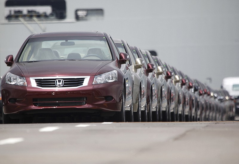 In this March 29, 2010 file photo, Japanese automaker Honda Motor Co.'s vehicles for export park at a Yokohama port, near Tokyo, Japan. China and Japan both condemned Thursday, May 24, 2018 the Trump administration's decision to launch an investigation into whether tariffs are needed on imports of vehicles and automotive parts into the United States. (AP Photo/Shizuo Kambayashi, File)