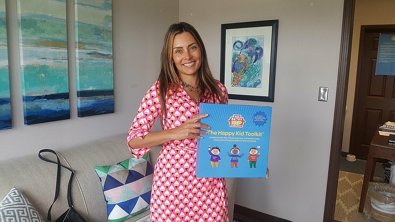 Danielle Alvarez Greer, Chattanooga's "Happy Family Coach" and creator of Happy Family Training, displays the accompanying Happy Kid Toolkit she designed. (Contributed photo)