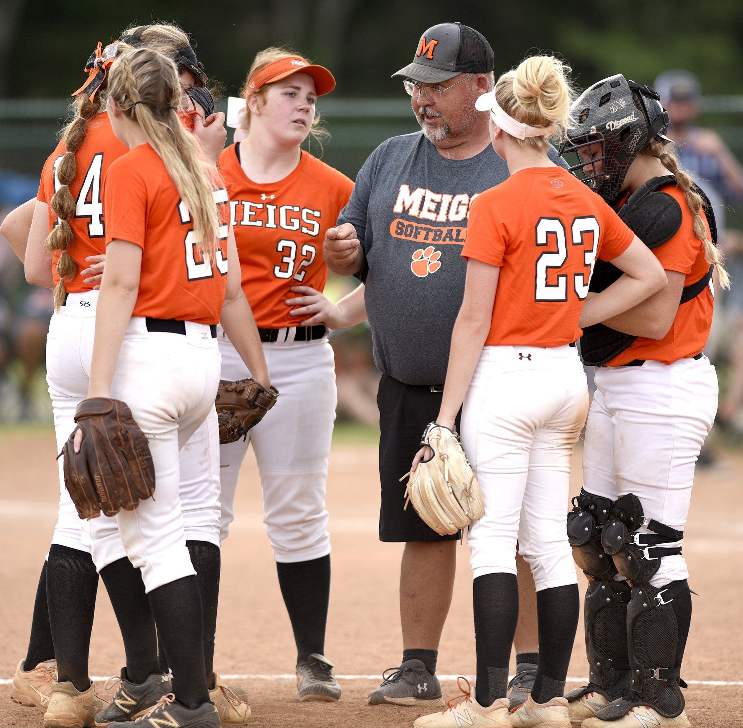 Meigs County head coach Jeff Davis tries to settle his Lady Tigers. White House Heritage forces a second game by defeating Meigs 3 to 1. Meigs County faced White House Heritage in the final of the TSSAA Class AA softball championship at the Starplex in Murfreesboro, Tenn. on May 25, 2018.