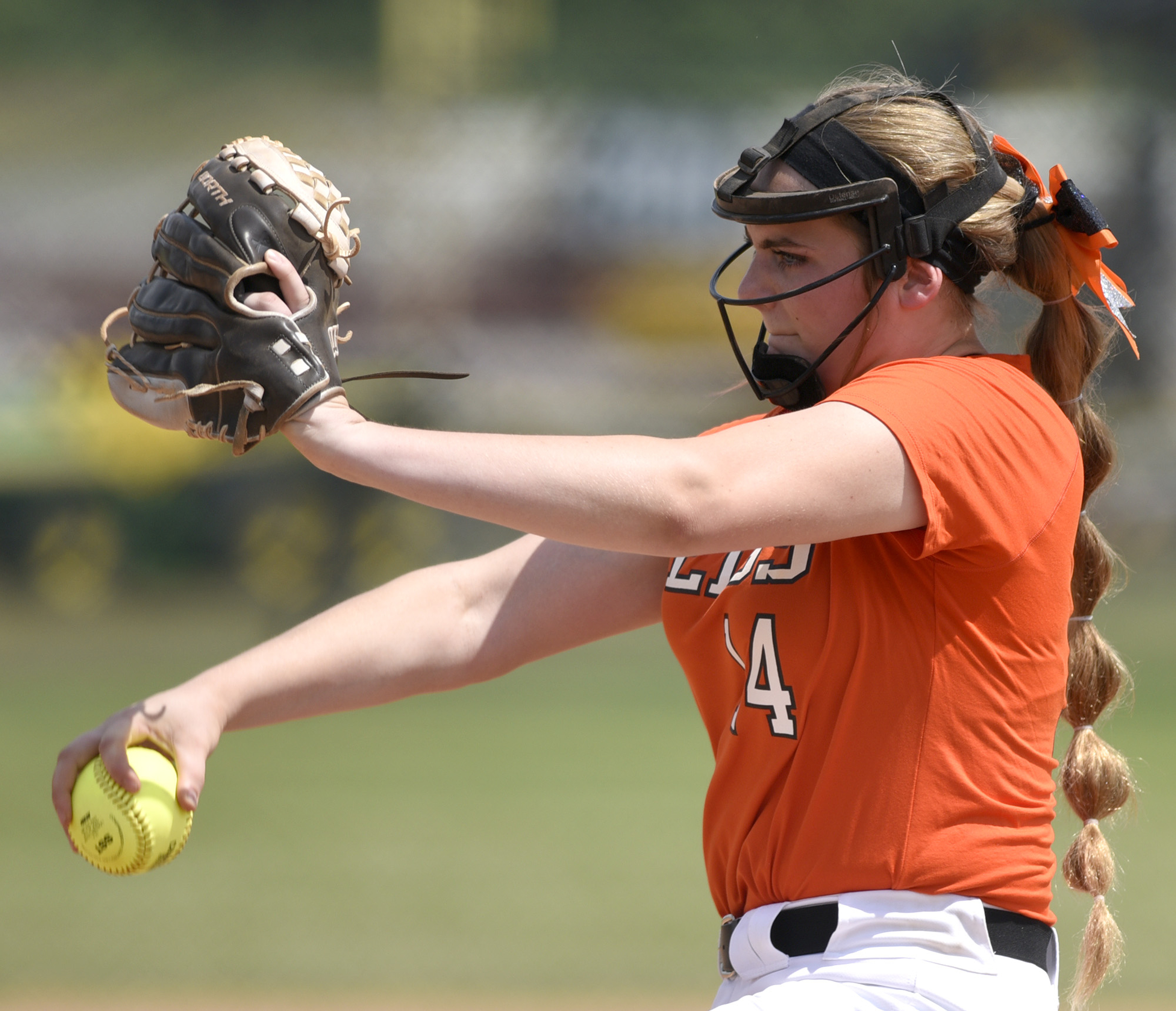 Meigs County pitcher, Ashley Rogers (14) winds up to pitch. White House Heritage forces a second game by defeating Meigs 3 to 1. Meigs County faced White House Heritage in the final of the TSSAA Class AA softball championship at the Starplex in Murfreesboro, Tenn. on May 25, 2018.