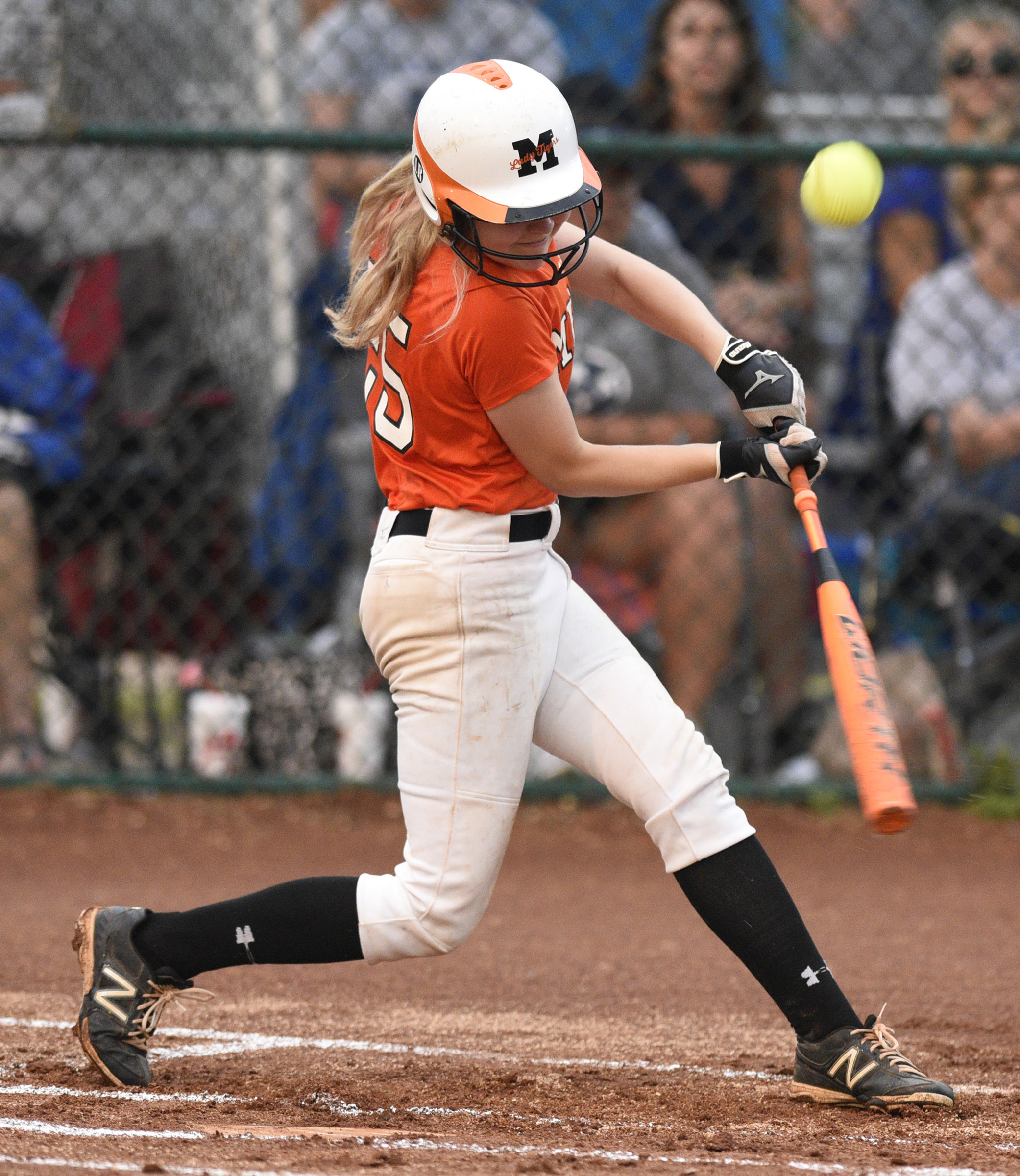 Meigs County's Kaylie Moore (25) gets underbeath a ball that would fall into right field for a hit in the final game of the TSSAA Class AA softball championship at the Starplex in Murfreesboro, Tenn. on May 25, 2018.