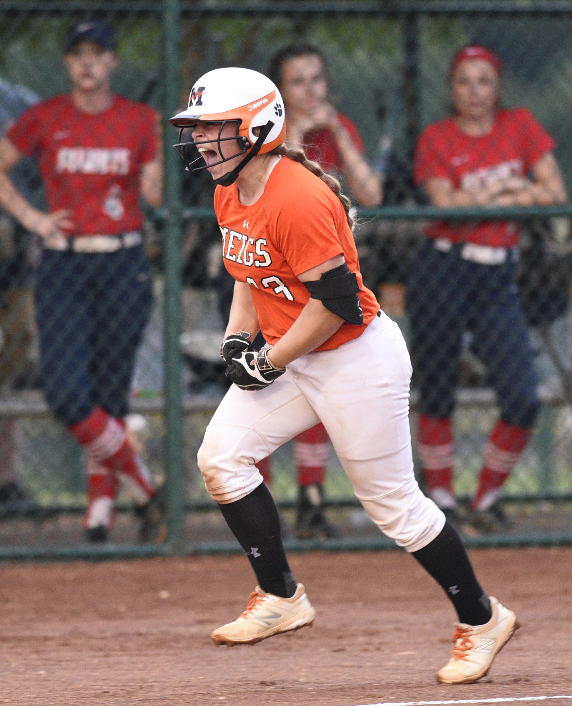 Meigs County's Aubrey Reed (33) yells as she heads home after heading a two-run homer in the final game of the TSSAA Class AA softball championship at the Starplex in Murfreesboro, Tenn. on May 25, 2018.