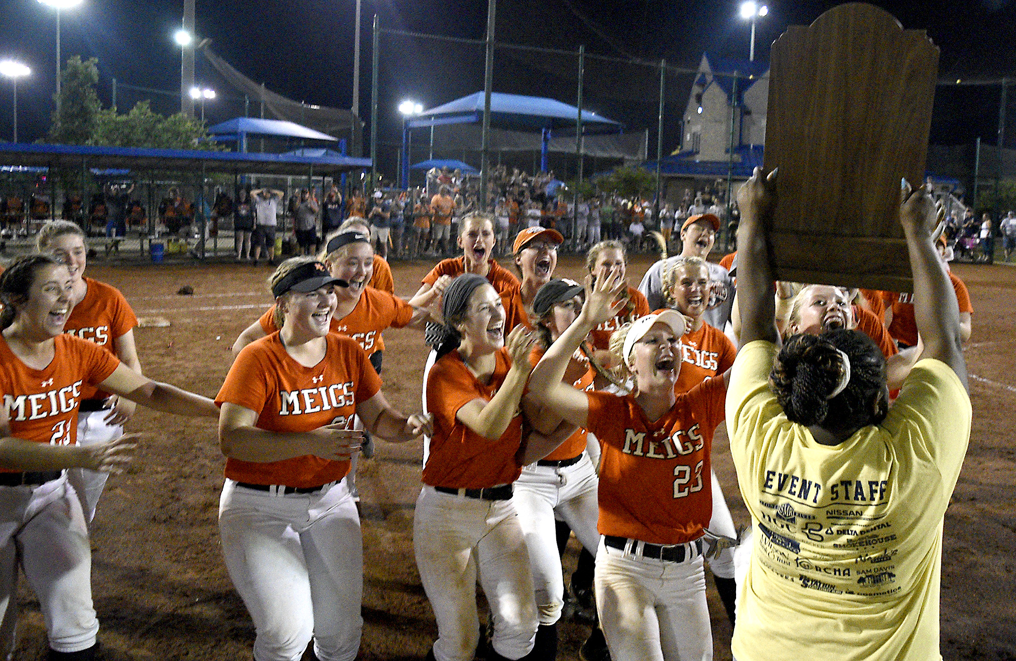 Meigs County players rush to claim the championship trophy after the final game of the TSSAA Class AA softball championship at the Starplex in Murfreesboro, Tenn. on May 25, 2018.