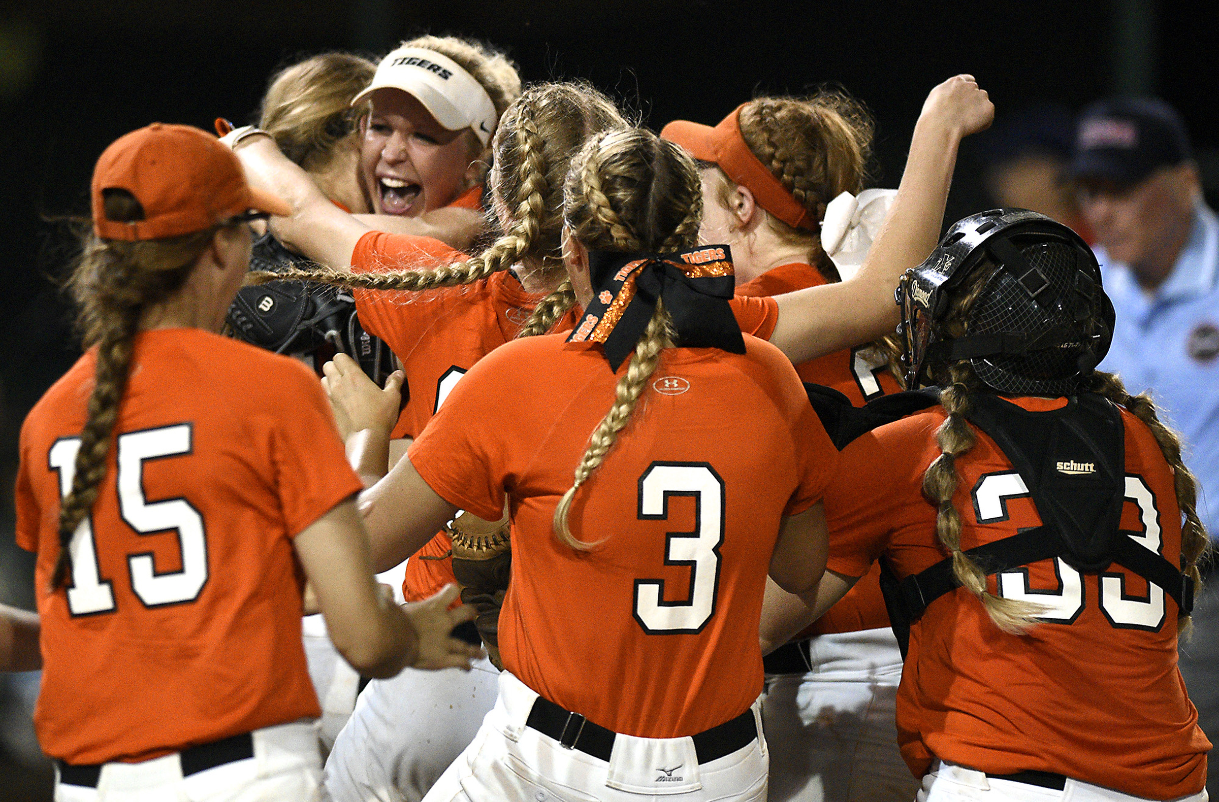 Pigtails fly as the Meigs County players embrace after defeating White House Heritage 3 to 1 in the final game of the TSSAA Class AA softball championship at the Starplex in Murfreesboro, Tenn. on May 25, 2018.